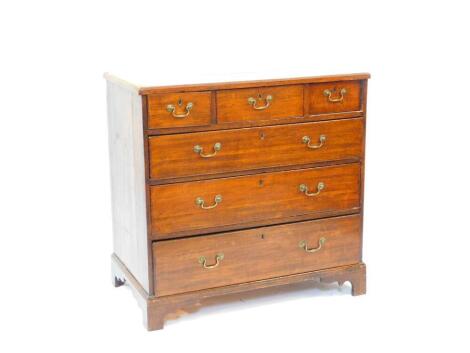 A George III oak chest of two short one medium and three long graduated drawers, raised on bracket feet, 90cm wide, 49.5cm deep, 88cm high.