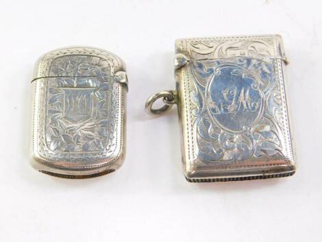 A Victorian silver vesta case, foliate engraved, shield reserve monogram engraved, Hilliard & Thomason, Birmingham 1888 and an Edward VII silver vesta case, foliate engraved, oval reserve monogram engraved, Birmingham 1908, 0.85oz.