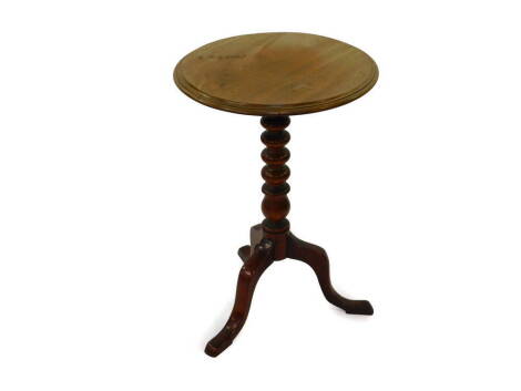 A Victorian mahogany tilt top occasional table, the circular top raised on a turned column over three cabriole legs, 45cm diameter, 66cm high.