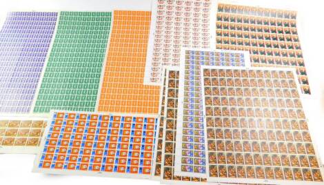 Philately. Three full sheets of UK definitives pre decimal stamps, 1/2d, 1 1/2d and 3d, and seven full sheets of UK pre decimal Christmas stamps, some with traffic light margins, and a part sheet of 1 shilling and sixpence Christmas stamps.