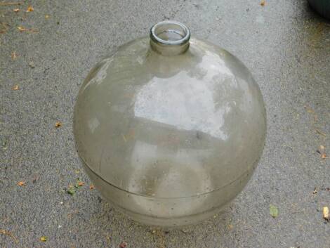 A large glass carbuoy.