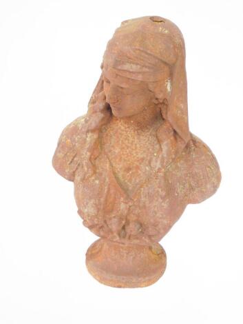 A cast iron bust of a Middle Eastern maiden, with headdress and downcast eyes, on integral socle base, 57cm high.