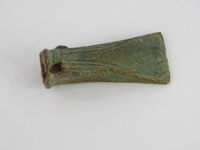 A Bronze Age bronze socket axe head, with reeded decoration to the sides, loop, etc. 10cm long. Provenance: Discovered during excavation work near Louth, Lincolnshire. - 2