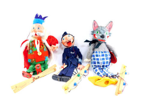 Three Pelham puppets, boxed, comprising Wolf, King and Policeman.