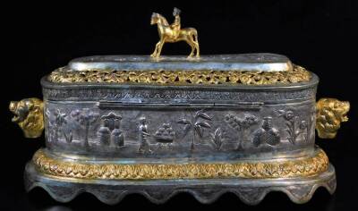 A highly elaborate Indian ceremonial freedom casket, of oval form, with horse and rider knop, flanked by lion mask handles, with a pierced arrangement of flower heads and scrolls, centred by a further arrangement of trees and buildings, on a shaped repeat - 4