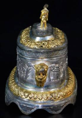 A highly elaborate Indian ceremonial freedom casket, of oval form, with horse and rider knop, flanked by lion mask handles, with a pierced arrangement of flower heads and scrolls, centred by a further arrangement of trees and buildings, on a shaped repeat - 5