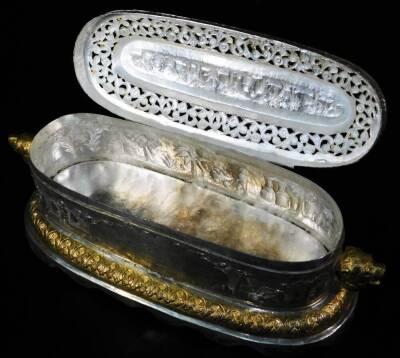 A highly elaborate Indian ceremonial freedom casket, of oval form, with horse and rider knop, flanked by lion mask handles, with a pierced arrangement of flower heads and scrolls, centred by a further arrangement of trees and buildings, on a shaped repeat - 8