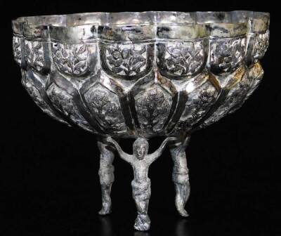 Various early 20thC dishes, various bowls, circular salt repousse decorated with various gods, flowerhead bowl on elaborate figural feet, 10cm high, 15cm wide, etc., Indian white metal, unmarked . (a quantity) - 3