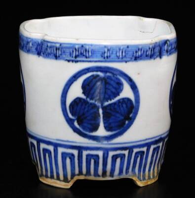 A lobed Japanese porcelain orchid pot, decorated with the Aoi mon of the Tokugawa family between key fret borders, signed illegibly to the side, 12.7cm high. - 2