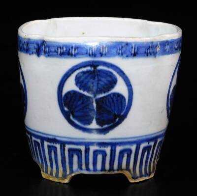 A lobed Japanese porcelain orchid pot, decorated with the Aoi mon of the Tokugawa family between key fret borders, signed illegibly to the side, 12.7cm high. - 3