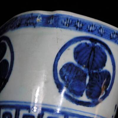 A lobed Japanese porcelain orchid pot, decorated with the Aoi mon of the Tokugawa family between key fret borders, signed illegibly to the side, 12.7cm high. - 8