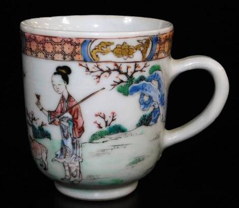 A Chinese export porcelain coffee cup, finely enamelled with women holding flowers, accompanied by two sheep, diaper border, 18thC, 6.4cm high.