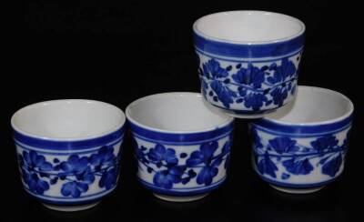 A pair of Japanese porcelain vases, each decorated with flowering shrubs on a white ground, marked JGC, similar cups, similar bowls, and a collection of other Oriental ceramics, blue and white tea bowls, etc. (a quantity) - 10