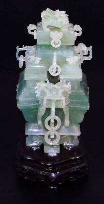 An elaborate Chinese green quartz quadruple vase, with four compartments and dragon head handles, with complex carved cover with dragon head and loose ring handles, wood base, tilled cloth covered box, early 20thC, 29cm wide. (boxed) - 2