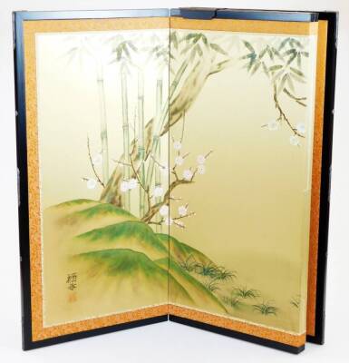 A 20thC four fold table Japanese screen, decorated with birds among prunus and bamboo, signed, with a black lacquered frame, 62cm high. - 2