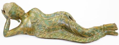 A Thai metal figure, of the reclining Buddha in flowing robes, 87cm wide.