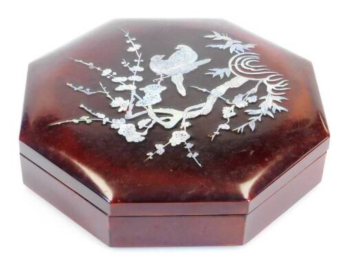 A late 20thC Chinese lacquer and mother of pearl finish box and cover, of hexagonal form decorated with flowering shrubs and exotic birds, with a fitted trays inside, 25cm wide.