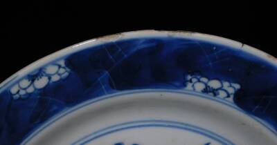 A Chinese circular porcelain dish, decorated with dragons chasing the flaming pearl, within a prunus border, double circle and seal mark beneath, ?;cm diameter. - 3