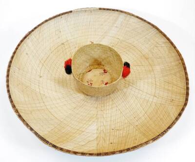 Two Vietnamese style Non La wide brim hats, each of circular form with wicker style centres, the exteriors decorated with central embroidered stars, 61cm diameter. (2) - 6