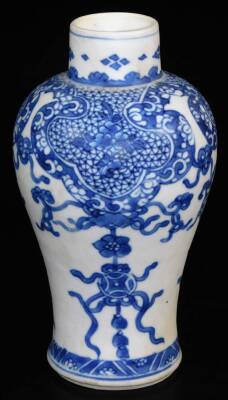 A Kangxi period blue and white baluster vase, with short neck from the Blue Chrysanthemum wreck, decorated with ribbons and bows beneath a shaped floral border, labelled beneath, 20cm high.