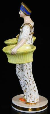 A Russian Gardner double salt figure, formed as a lady in flowing robes holding yellow salts, on a circular base with gilt highlights, polychrome decorated with double sword style mark beneath, 25cm high. - 2