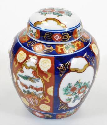 An early 20thC Japanese Satsuma cup and saucer 12cm diameter, decorated with birds and flowers, a shell shaped dish, Imari style plate, lidded jars, ginger jar, gong and a slender vase. - 10