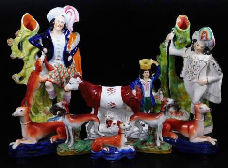 Various Staffordshire figures, 19thC and other greyhound groups, to include a pair with hare to each mouth, polychrome decorated, 17cm high, two recumbent greyhound inkwells, another, a 19thC flat back cow, calf and farmer group and two further flat back 