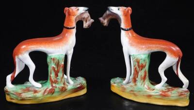 Various Staffordshire figures, 19thC and other greyhound groups, to include a pair with hare to each mouth, polychrome decorated, 17cm high, two recumbent greyhound inkwells, another, a 19thC flat back cow, calf and farmer group and two further flat back - 11