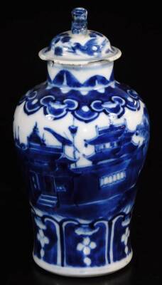 A late 19thC Chinese porcelain baluster vase and associated cover, the main body profusely decorated with buildings, trees and figures with a lower geometric border, four character Kangxi mark beneath, 18cm high. - 2