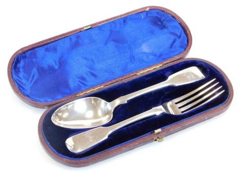 A Victorian silver christening set, comprising fork and spoon, fiddle pattern, initialled London 1860, 2.8oz. (cased)