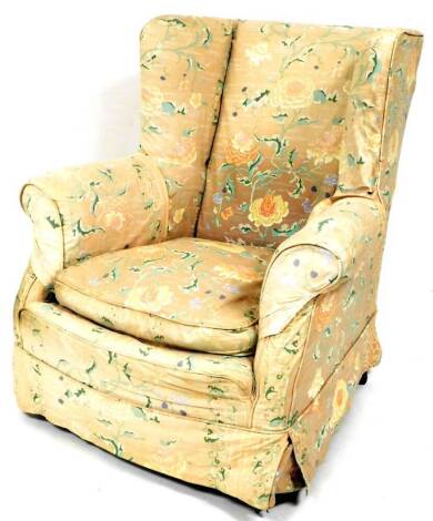 A Victorian wing back armchair, with bun feet and matched upholstery to the previous chair.