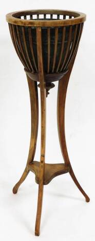 A Victorian mahogany jardiniere stand, with moulded top, reeded baluster and tripod base, 108cm high.