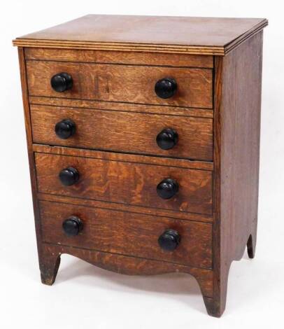 An early 19thC oak commode chest, 58cm wide, 75cm high, 44cm high approx.