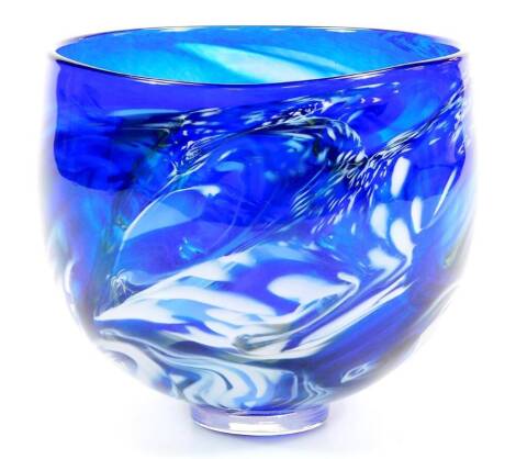 A 20thC studioOur Glass 2012 bowl, of globular form decorated in a swirl pattern, predominantly in blue and white, on circular foot, 16cm diameter.