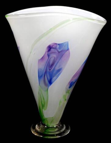 A 20thC studio glass vase, of shaped form, predominantly in purple and green, on a green ground, on circular fan foot, unsigned, 27cm high.