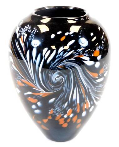 An Our Glass studio glass vase, of ovoid form, in orange and white speckles on black glass, signed and dated 2009, 20cm high.