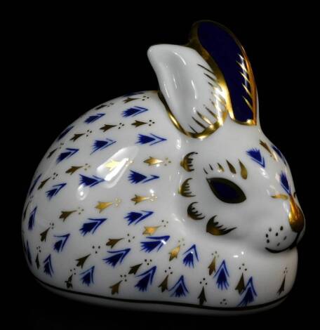 A Royal Crown Derby paperweight rabbit ornament, gilt stopper, 8cm wide. (boxed)