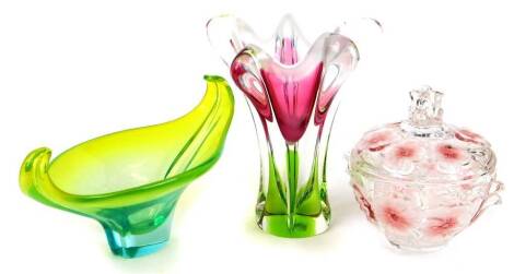 A Chribska Josef Hospodka glass vase, of flared form in pink, clear and green glass, unmarked, 25cm high, a lidded bonbon jar and a shaped green, clear and yellow glass vase, of scroll form. (3)