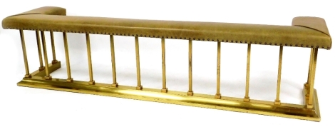 A Victorian style club fender, with leatherette top, raised on vertical brass bars with a plain D end base, 50cm high, 202cm wide, 47cm deep.