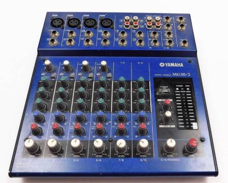 A Yamaha MG10/2 mixing console, blue and black colour way, 25cm wide.