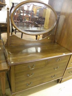 An Edwardian mahogany dressing table with an oval mirror