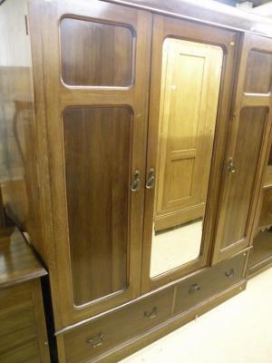 An Edwardian mahogany wardrobe with two panelled doors