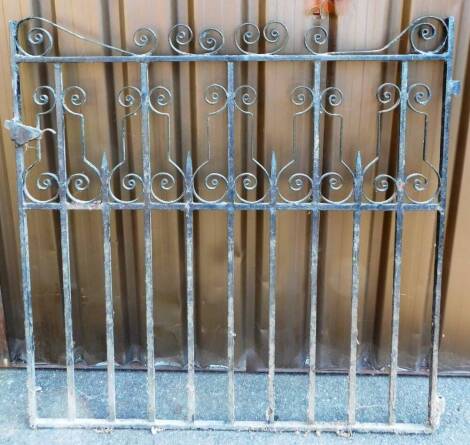 A 20thC wrought iron gate, with vertical bars broken by shaped sections, 122cm wide.