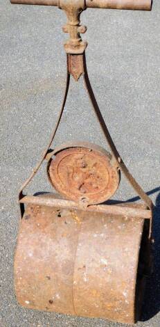 A late 19thC heavy garden roller, with turned handle and shaped centre section, 106cm high.