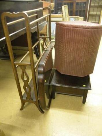 An Edwardian oak towel rail