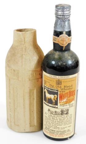 A bottle of 1938 Old Blend White Horse Cellar scotch whisky, with outer White Horse cover, 30cm high.