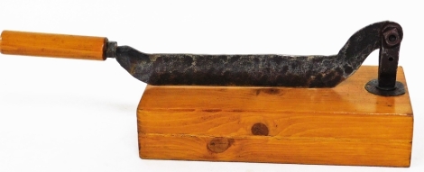 A guillotine or herb chopper, with metal blade, on a pine block base, 20cm high.