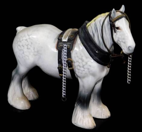 A Beswick grey shire horse, with leather style tack, printed marks beneath, 20cm high.