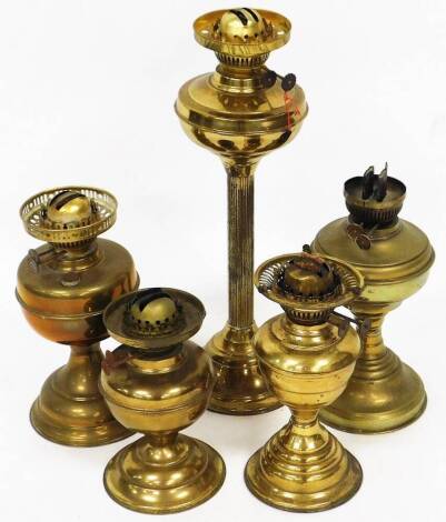 Various early 20thC brass oil lamp bases, to include one with a reeded stem, 49cm high, etc. (a quantity)