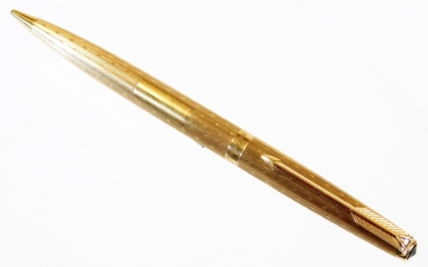 A 9ct gold Parker pencil, with engine turned body, plain cartouche and arrow clip, 12cm wide.